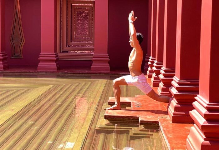 Gay man doing yoga at The BARAI, a luxury wellness beach hotel in Hua Hin, Thailand. Hyatt Regency Hua Hin.