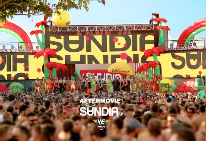 Madrid's MACHO Party at a Gay Club: A large crowd enjoys the Sundia event, with performers on stage and watermelon decor.