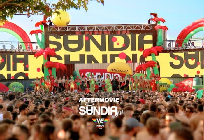 Madrid's MACHO Party at a Gay Club: A large crowd enjoys the Sundia event, with performers on stage and watermelon decor.