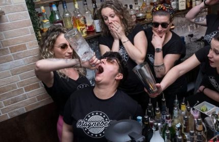 Magnebevo bar staff in Rome's Pigneto district pour a drink directly into a customer's mouth. A fun, gay-friendly travel experience.