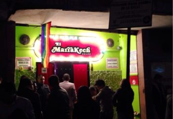 El Marrakech Salon, a gay bar in Mexico, with a rainbow flag. Nightlife scene for gay men traveling in Mexico.