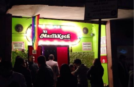 El Marrakech Salon, a gay bar in Mexico, with a rainbow flag. Nightlife scene for gay men traveling in Mexico.