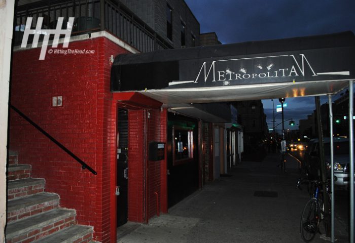 Metropolitan Bar for queers in New York. Exterior shot of the popular gay bar's entrance at night. Red brick and awning.