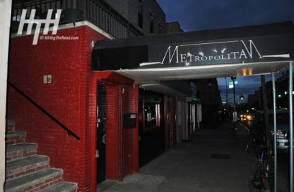 Metropolitan Bar for queers in New York. Exterior shot of the popular gay bar's entrance at night. Red brick and awning.
