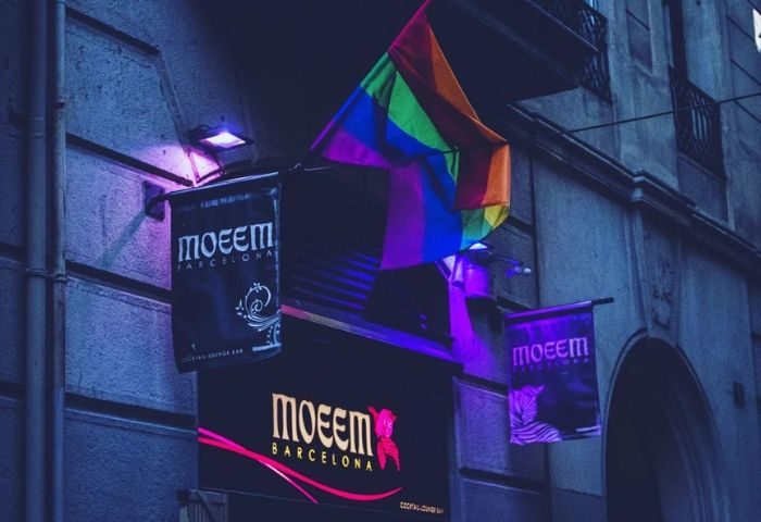 Moeem Barcelona gay bar. Rainbow flag above the entrance of Moeem, a popular gay bar in Barcelona, Spain. Nightlife for gay men travelers.