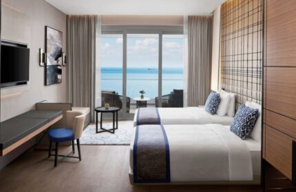 JW Marriott Hotel Istanbul Marmara Sea room. Solo gay travel hotel, twin beds, sea view balcony. Most booked hotel for gay men.