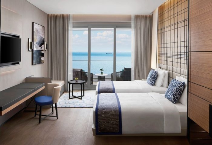 JW Marriott Hotel Istanbul Marmara Sea room. Solo gay travel hotel, twin beds, sea view balcony. Most booked hotel for gay men.