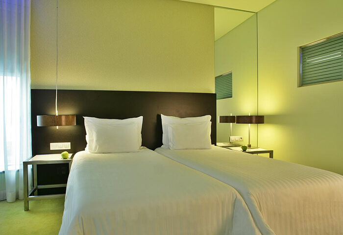 SANA Capitol Hotel Lisbon room. Most booked budget gay hotel. Twin beds, modern design. Gay travel advice.