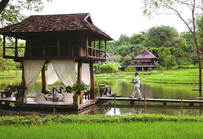 Four Seasons Resort Chiang Mai: Luxury gay hotel with stilt pavilion over water, server, rice paddies. Thailand travel.