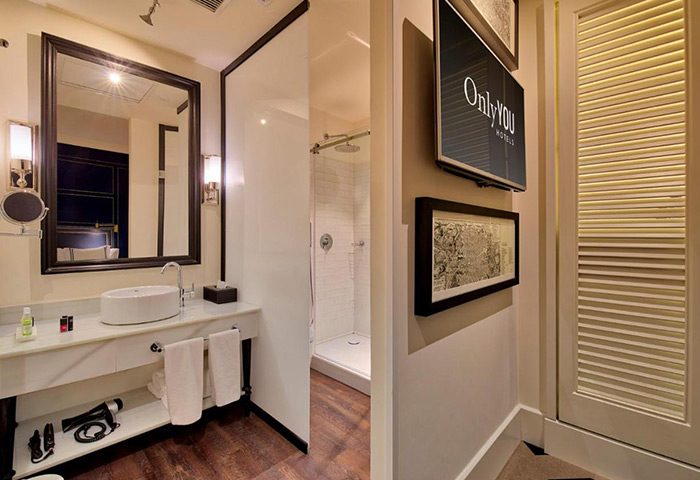 Bathroom at Only YOU Boutique Hotel Madrid, a top-rated gay honeymoon hotel in Madrid's Chueca gayborhood. Modern design with shower.