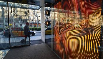 Hotel Soho Barcelona entrance. Most-booked gay hotel in Eixample gayborhood, Barcelona. Man entering, modern design.