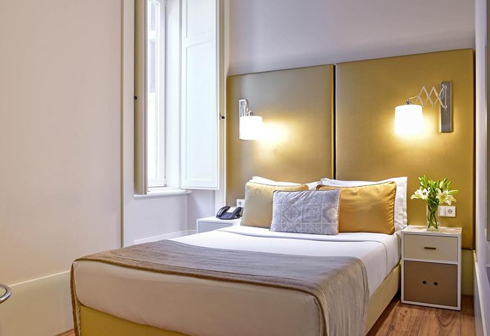 My Story Hotel Ouro, Lisbon: Cozy room with double bed, bedside tables, and lamps. A most-booked gay hotel in Lisbon city center.