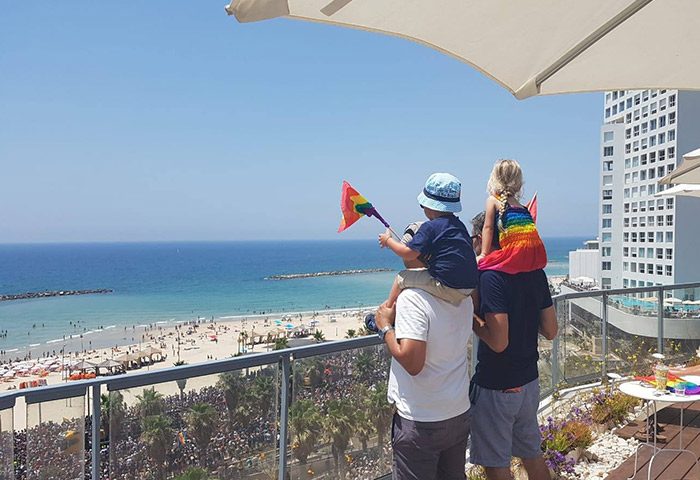 Maxim Design Hotel 3 Star Superior view. Gay couple with kids at Tel Aviv Pride. Beach view from most booked gay hotel for honeymooners.