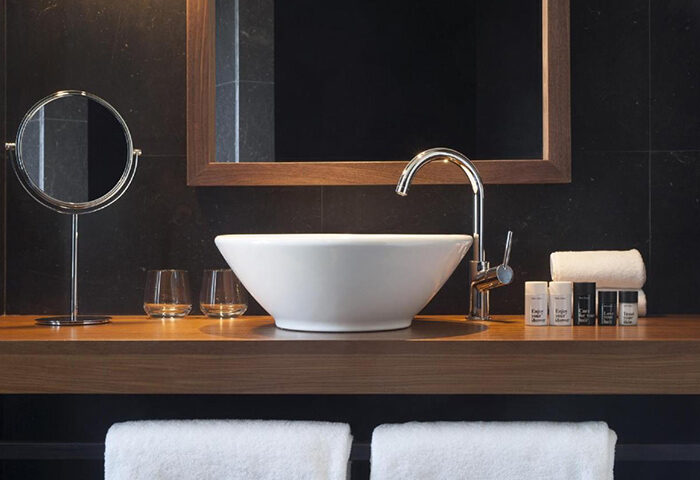 Dear Hotel Madrid bathroom detail. Modern sink, mirror, and amenities. Most-booked gay hotel in Madrid's Gayborhood, Gran Via & Chueca.