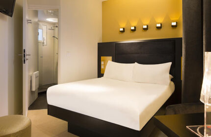 Le Relais du Marais Hotel room. Modern decor, double bed, ensuite bathroom. Most booked gay-friendly hotel in Paris' Marais gayborhood.