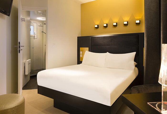 Le Relais du Marais Hotel room. Modern decor, double bed, ensuite bathroom. Most booked gay-friendly hotel in Paris' Marais gayborhood.
