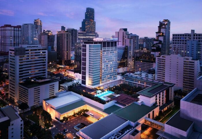 Pullman Bangkok King Power: Gay-friendly hotel with outdoor pool. Bangkok skyline view at dusk. Most-booked hotel for gay travelers.
