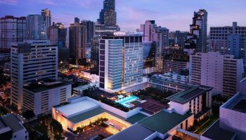 Pullman Bangkok King Power: Gay-friendly hotel with outdoor pool. Bangkok skyline view at dusk. Most-booked hotel for gay travelers.