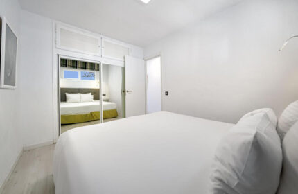 Atlantic Sun Beach Gay Men Only hotel room. Modern design, white walls, double bed. Gay nightlife in Playa del Ingles, Gran Canaria.