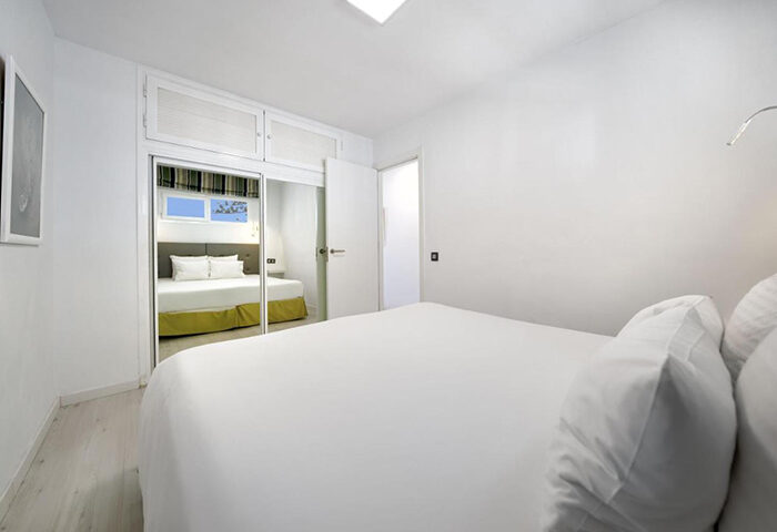 Atlantic Sun Beach Gay Men Only hotel room. Modern design, white walls, double bed. Gay nightlife in Playa del Ingles, Gran Canaria.