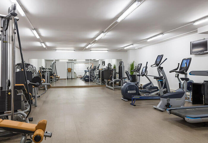Melia Sitges hotel gym. Fitness center with weight machines, treadmills, and elliptical trainers. Popular gay hotel near Sitges nightlife.