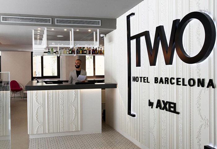 Reception area at TWO Hotel Barcelona by Axel, an adults-only gay hotel. Modern design, stylish decor, and friendly staff. Gay travel in BCN.