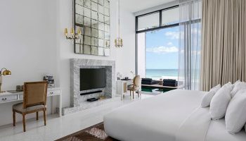 Luxury beachfront hotel room at The Library Hotel in Koh Samui, Thailand. A top gay honeymoon destination with ocean view.