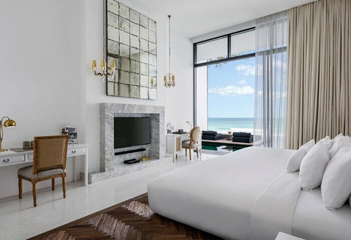 Luxury beachfront hotel room at The Library Hotel in Koh Samui, Thailand. A top gay honeymoon destination with ocean view.