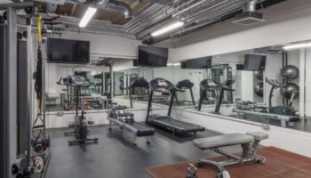 Leman Locke gym in London. This luxury hotel's fitness center features treadmills, weights, and mirrored walls for gay travelers.