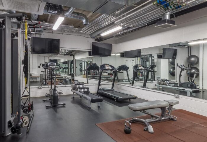 Leman Locke gym in London. This luxury hotel's fitness center features treadmills, weights, and mirrored walls for gay travelers.