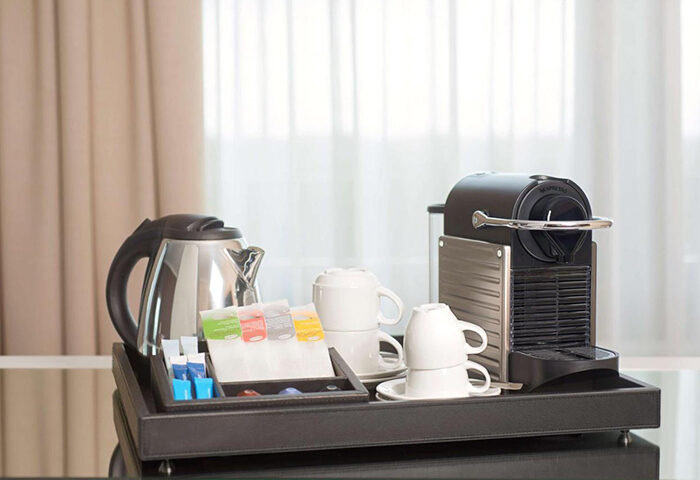 NH Collection Madrid Gran Via: Coffee and tea setup in a room at this upscale Madrid city center hotel. Gay travel lodging.