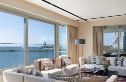 Luxury JW Marriott Hotel Istanbul Marmara Sea beachfront suite. Upscale gay hotel with sea view. Modern interior design, perfect for gay travel.