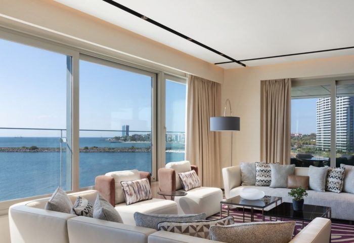 Luxury JW Marriott Hotel Istanbul Marmara Sea beachfront suite. Upscale gay hotel with sea view. Modern interior design, perfect for gay travel.