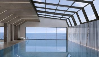 Indoor pool at JW Marriott Hotel Istanbul Marmara Sea. Luxury beachfront wellness hotel with sea view. Gay-friendly travel destination.