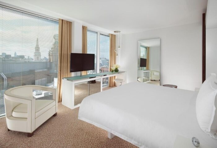 St Martins Lane Hotel London room. Modern design, city view. Gay-friendly hotel in London City Center. Comfortable bed, TV, and stylish decor.
