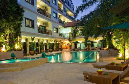 Baan Souy Resort pool view. Popular gay adult's-only hotel with gym. Gay travel advice, tropical resort, swimming pool, lounge chairs.