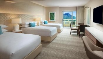 Sheraton Waikiki Beach Resort room with three beds, balcony, and mountain view. Popular gay beachfront hotel for gay groups.