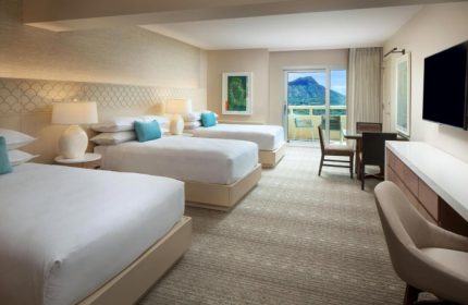 Sheraton Waikiki Beach Resort room with three beds, balcony, and mountain view. Popular gay beachfront hotel for gay groups.
