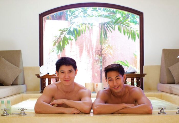 Gay honeymoon: Two men relax in a tub at THE BARAI, Hyatt Regency Hua Hin hotel. Thailand honeymoon destination for gay couples.