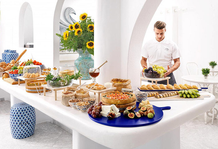 Mykonos Bay Resort & Villas breakfast buffet. Gay hotel in Mykonos Town for gay travelers. Fresh fruits, pastries, and local delicacies.