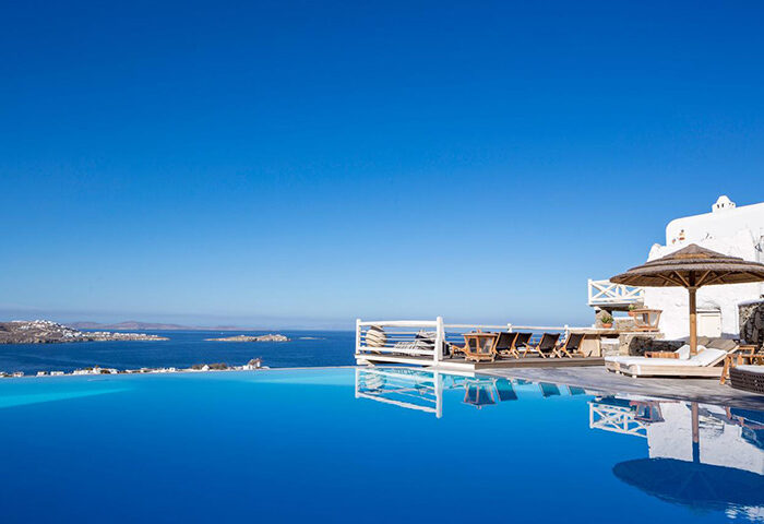 Vencia Boutique Hotel infinity pool in Mykonos Town. Popular gay hotel with sea view. Luxury travel for gay men in Mykonos, Greece.
