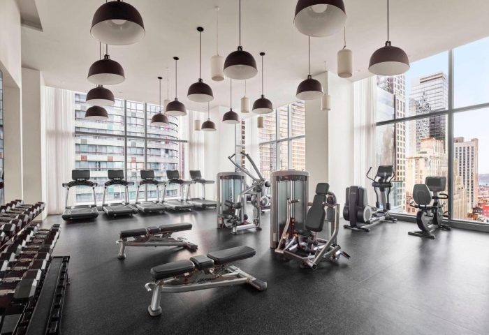 The Times Square EDITION gym. Hotel fitness center with treadmills, weights, and city views. Popular gay hotel near Hell's Kitchen.