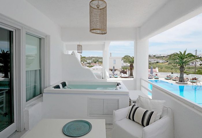 Andronikos Hotel Mykonos: Balcony view with private hot tub. Popular gay hotel in Mykonos Town with swimming pool. Luxury travel destination.