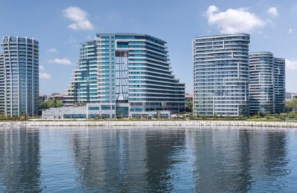 JW Marriott Hotel Istanbul Marmara Sea beachfront view. Luxury hotel perfect for gay travel. Modern architecture reflecting in the water.