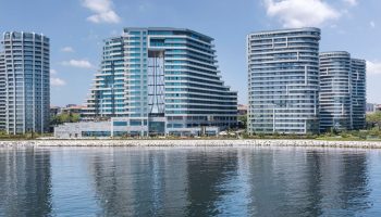 JW Marriott Hotel Istanbul Marmara Sea beachfront view. Luxury hotel perfect for gay travel. Modern architecture reflecting in the water.