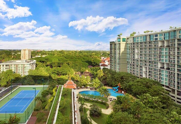 Shangri-La Hotel Chiang Mai overview. Luxury gay travel hotel with pool, tennis court, lush greenery, and city views. Top choice for gay travelers.