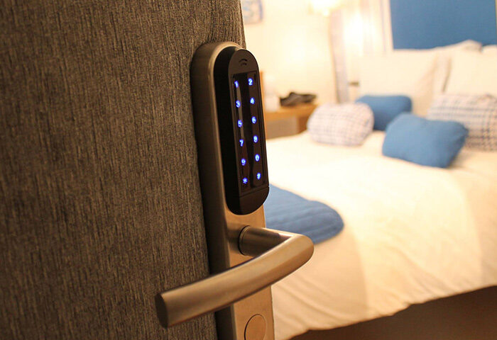 Digital door lock at My Rainbow Rooms, a popular gay men's guest house in Lisbon. Modern hotel room for gay travelers.