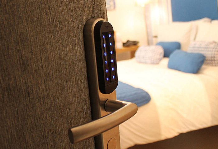 Digital door lock at My Rainbow Rooms, a popular gay men's guest house in Lisbon. Modern hotel room for gay travelers.