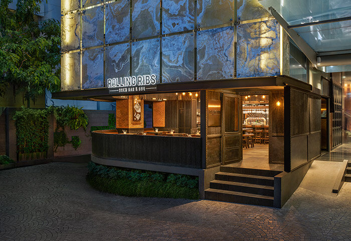 Le Méridien Bangkok's Rolling Ribs Brew Bar & BBQ, a popular restaurant for gay people. Exterior view of the stylish bar and restaurant.