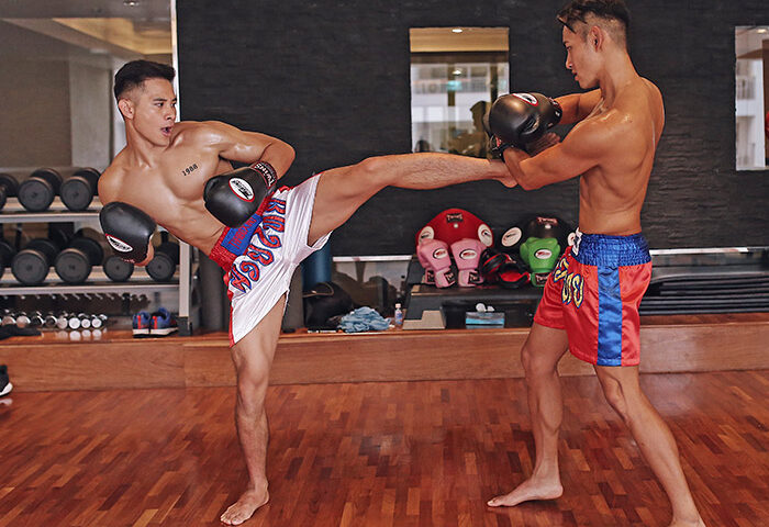 Gay-friendly Banyan Tree Bangkok: Two shirtless men practice Muay Thai boxing. Gym activity at this Bangkok hotel for gay men.